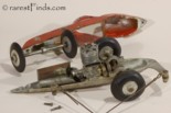 Inside view of vintage Mite Miniature Tether Race Car showing engine, gas tank, and final drive.